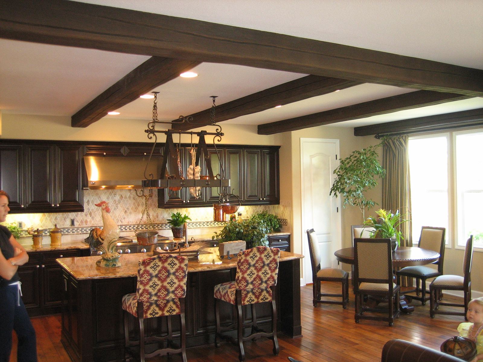Faux wood beams over a kitchen and dining area